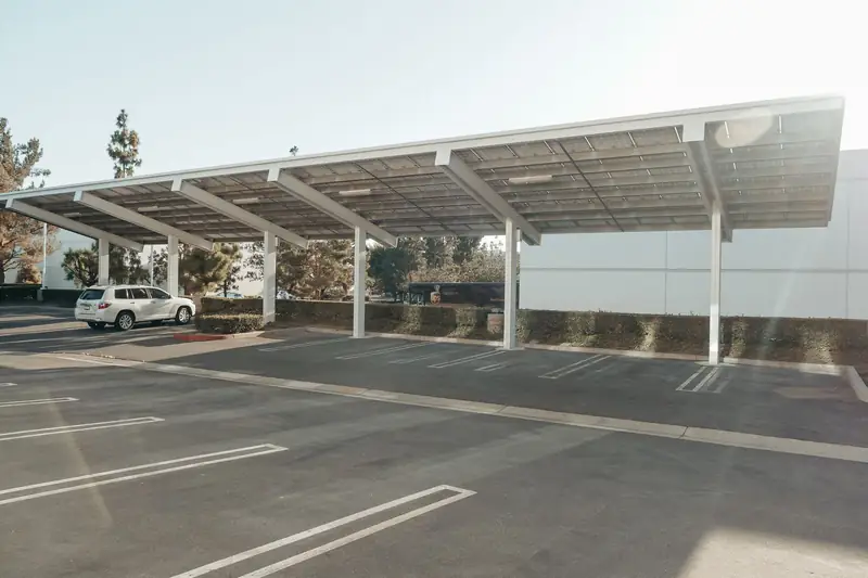 Solar panel carport canopy over a business parking lot
